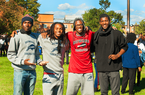 Group of four young african american college students on the yard at Howard